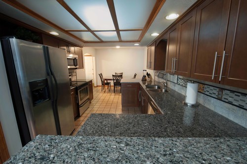 New Caledonia Granite Countertop Dark Cabinets Heat Resistant Different Slabs